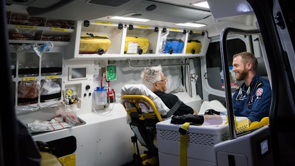 Paramedic Gareth Garne shares a laugh with an 82-year-old patient from Bellevue Hill.