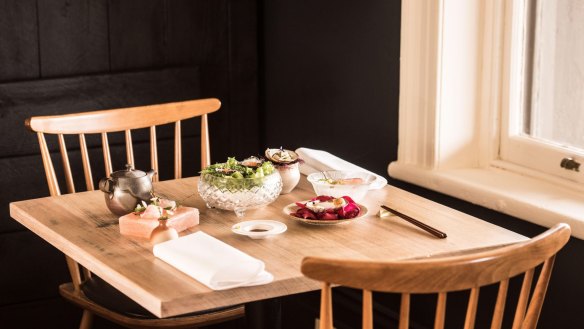 Kadota's 40-seat dining room features charred timber walls, known as shou sugi ban.
