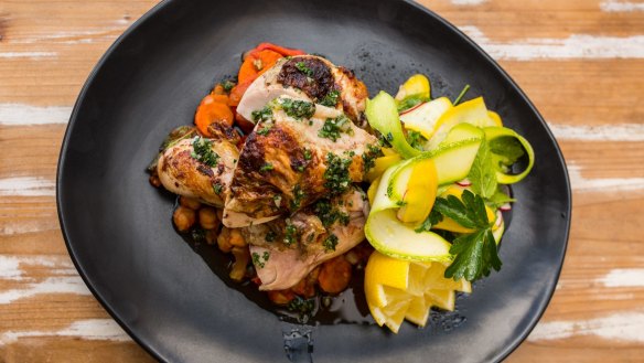 Wood-fire roasted chicken served over vegies at Passing Clouds.