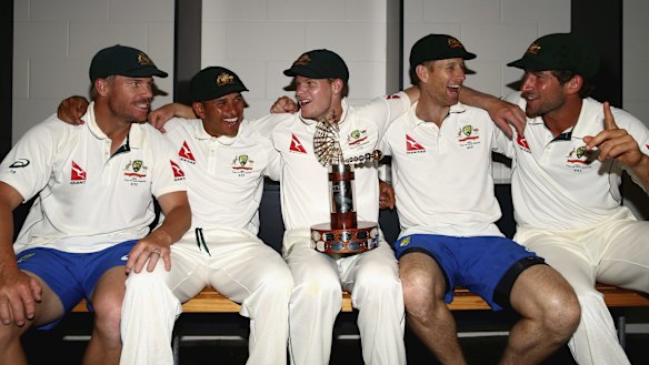 Happy bunch: (From left) David Warner, Usman Khawaja, Steve Smith, Adam Voges and Joe Burns celebrate with the Trans-Tasman Trophy.