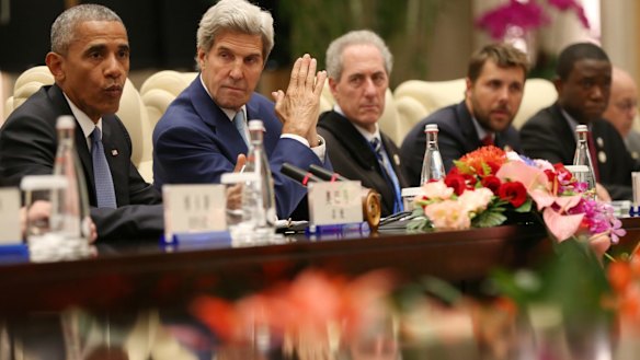 U.S. President Barack Obama, left, and Secretary of State John Kerry, second left, meet with the delegation of Chinese President Xi Jinping on the sidelines of the G-20 summit in Hangzhou, China.