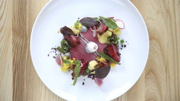 Salad nicoise with yellowfin tuna, kalamata olives, poached quail egg.
