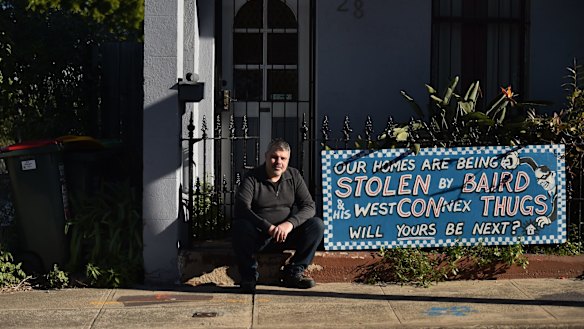 Disgruntled owner Richard Capuano with a protest sign outside his St Peters home. 