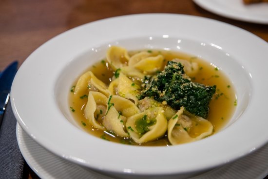 Duck and chestnut tortellini with braised greens and broth. 