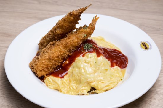 Omurice with tempura, tomato sauce and melted cheese.