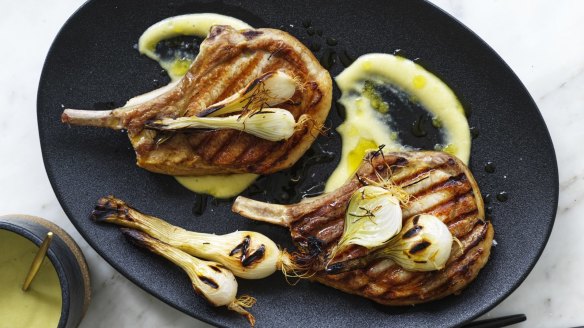 Barbecued pork chops with lemon garlic sauce and pickled spring onions.