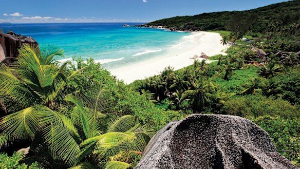A beach in the Seychelles where TitanTrade website operator One Tech Media is located.  