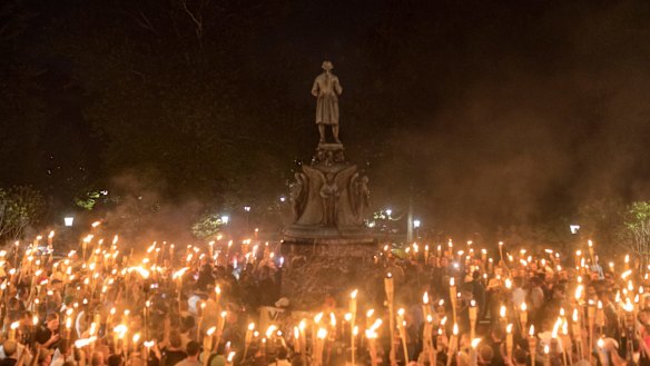 Torch-bearing white nationalists rally around a statue in Charlottesville.