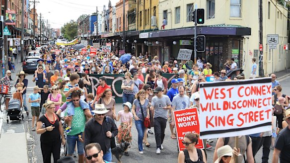 Concerned residents take to the streets of Newtown, Sydney, on Sunday to protest the proposed development of the NSW government's WestConnex tunnel and road project.