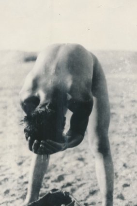 A member of the 7th Australian Light Horse Regiment having a bath in the desert in preparation for returning to Gallipoli.