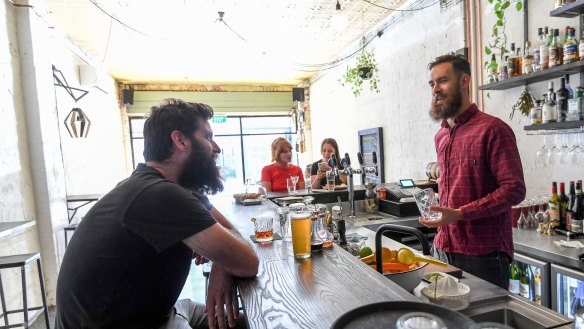 Owner Gene Mills behind the bar at Dunning Kruger in Brunswick East.