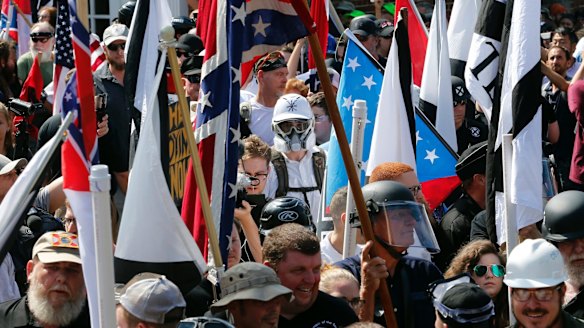 White nationalist demonstrators are surrounded by counter demonstrators in Charlottesville.