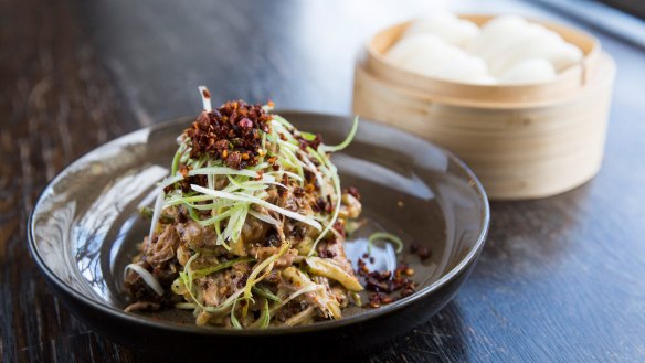 Sichuan-style lamb shoulder served with bao.