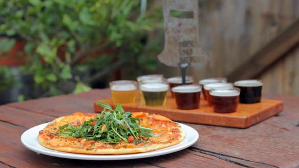 A tasting paddle of beers from Bridge Road Brewers and a sweet potato and gorgonzola pizza.