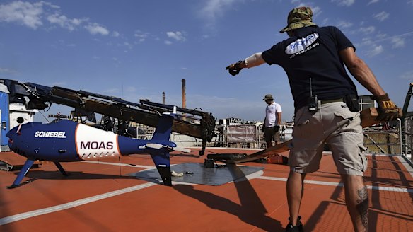 A drone sits on the upper deck of the MY Phoenix as it prepares to rescue refugees attempting to cross from Libya to Europe.