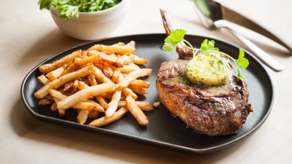 On the menu: Char-grilled fillet steak with fries and herb butter.