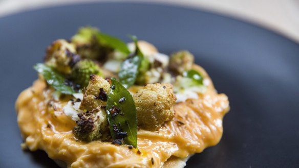 Scrambled eggs with cauliflower, pita and fried curry leaves at Higher Ground.