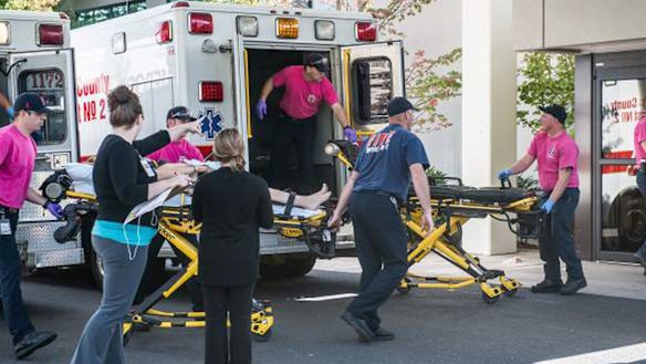 A patient is wheeled into the emergency room at Mercy Medical Centre in Roseburg, Oregon, following a deadly shooting at Umpqua Community College, in Roseburg on Thursday