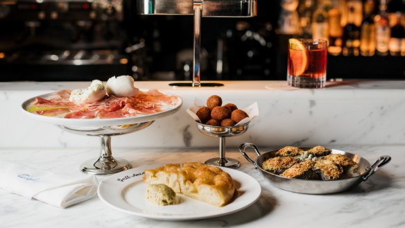 Cicchetti include salumi, potato focaccia with green olive butter, chicken croquettes and oysters Americano.