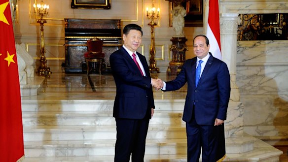 Egyptian President Abdel Fattah al-Sissi, right, shakes hands with Chinese President Xi Jinping.