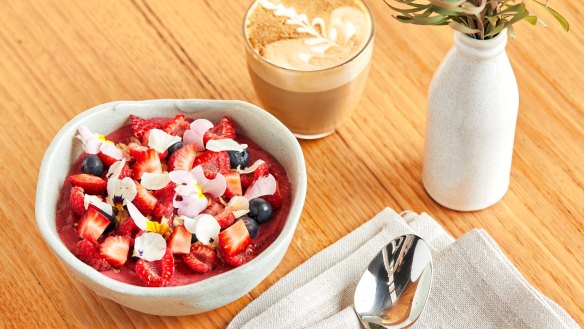 Acai bowl with honey granola and winter berries.