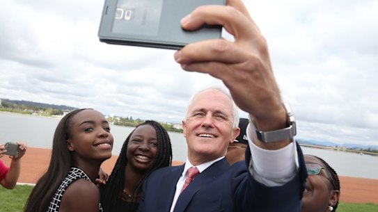 Malcolm Turnbull takes a selfie with new Australian citizens Lydia Banda-Mukuka and Chilandu Kalobi Chilaika on Australia Day last year.
