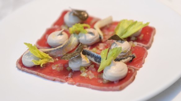 Tuna carpaccio with veal mayo flips vitello tonnato.