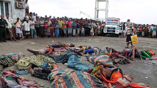 Bodies of Somalis killed in attack off the coast of Yemen lie on the ground at the Red Sea port of Hodeida, Yemen.