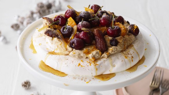 Adam Liaw's Christmas pudding inspired pavlova with spiced brandy-spiked cream.