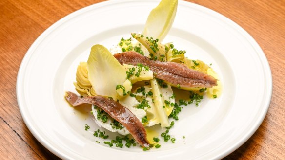 Artichoke entree with buffalo mozzarella, endive and anchovies.