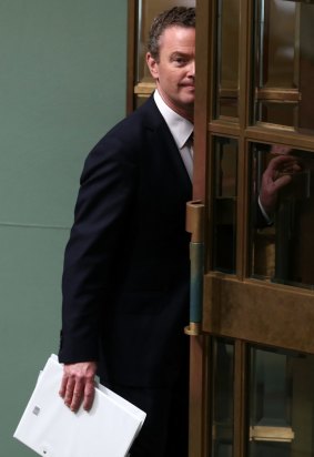 Education Minister Christopher Pyne leaves the House of Representatives after reintroducing a bill to deregulate universities.