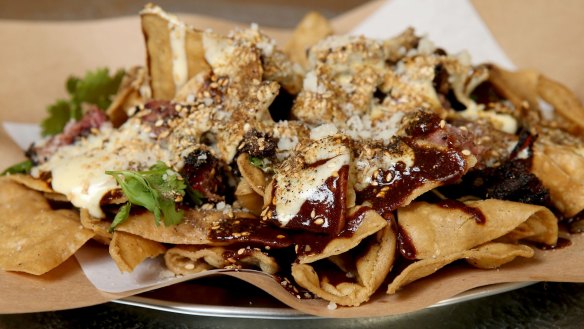 Nachos with smoked brisket and mole sauce.