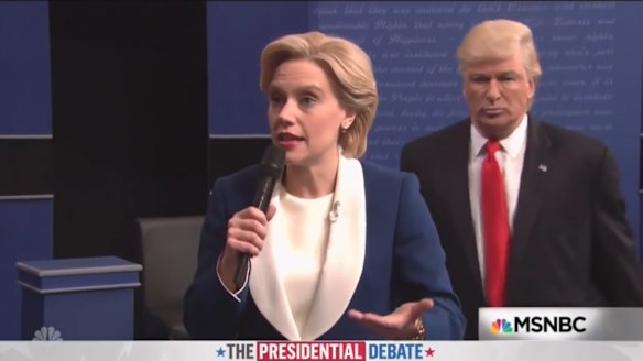 Kate McKinnon and Alec Baldwin mocked the recent debate where Trump was seen looming over Clinton.