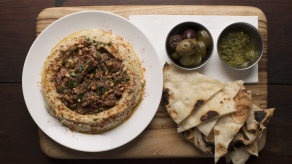 Hummus with lamb and flatbread.