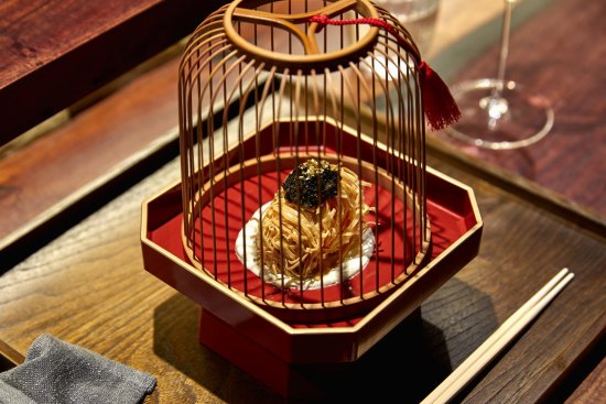 "Sea treasure" ball presented in a wooden birdcage.