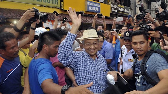 Former Malaysian PM Mahathir Mohamad joined anti-government protesters at a rally organised by pro-democracy group "Bersih" (Clean) in Kuala Lumpur in August.