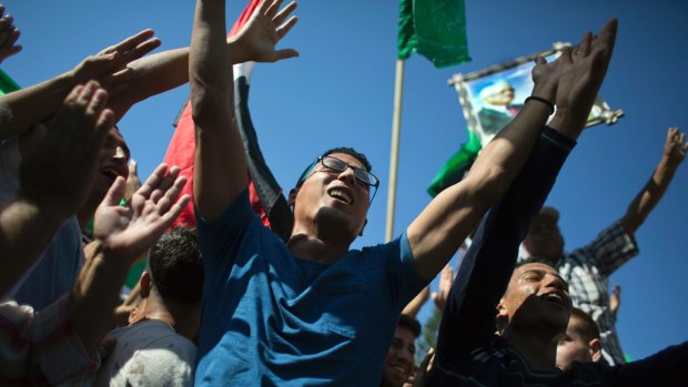 Palestinians celebrate the signing of the reconciliation agreement between Hamas and Fatah.