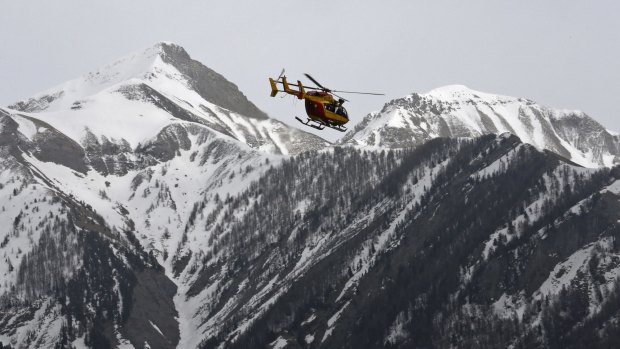 A rescue helicopter from the French Securite Civile flies over the French Alps.