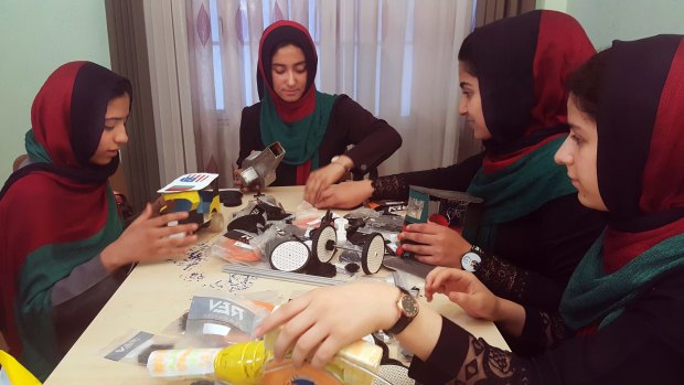 Teenagers from the Afghanistan Robotic House, a private training institute, practice at the Better Idea Organisation center, in Herat, Afghanistan. U.S. President Donald Trump intervened to allow the group of Afghan girls into the country to participate in a robotics competition.