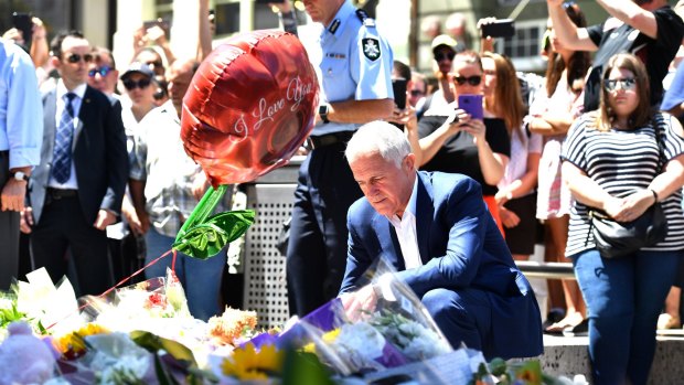 Prime Minister Malcolm Turnbull lays flowers in Bourke Street.