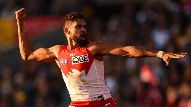 Lewis Jetta performs an indigenous spear-throwing dance in support of Goodes.