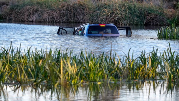 The family's car submerged in the lake off Manor Lakes Boulevard.