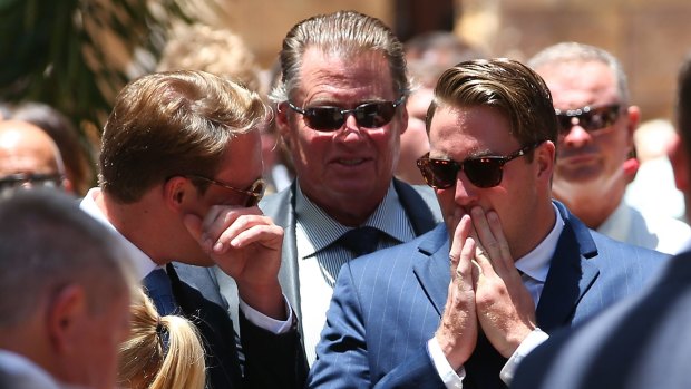 Cole Miller's father Steven and brothers Billy and Mitchell at Cole's funeral.