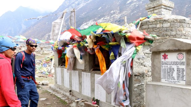 Prayer flags over the memorial mani wall in new Langtang village.