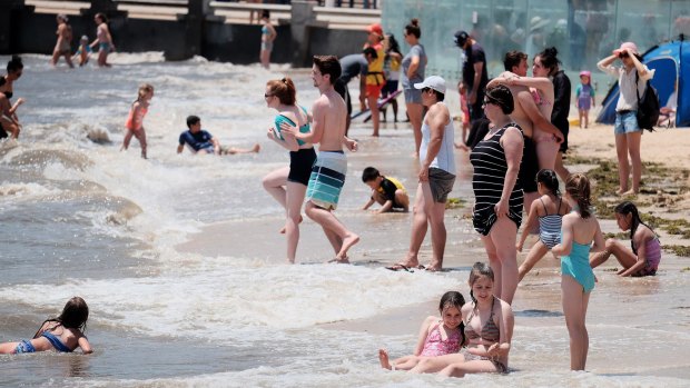 Crowds enjoy a summer's day on Eastern beach in Corio Bay, Geelong.