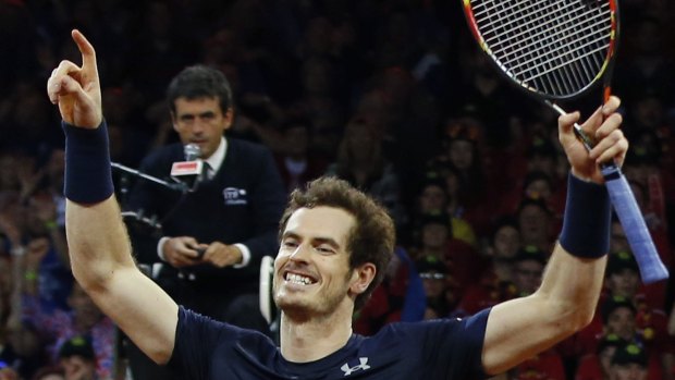 Britain?s Andy Murray celebrates winning the doubles Davis Cup final tennis match with his brother Jamie in four sets, 4-6, 6-4, 6-3, 6-2, against Belgium?s Steve Darcis and David Goffin at the Flanders Expo in Ghent, Belgium, Saturday, Nov. 28, 2015. (AP Photo/Alastair Grant)