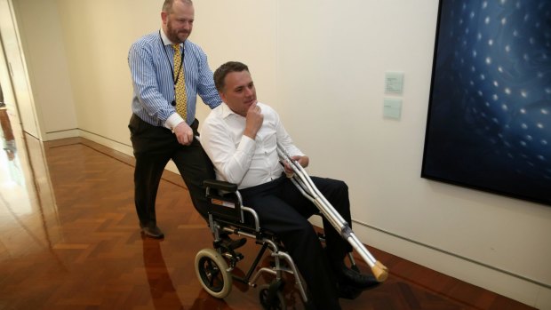 Assistant Infrastructure Minister Jamie Briggs emerged in a wheelchair after a wild party in the Prime Minister's suite. 