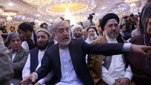 Afghan presidential candidate Abdullah Abdullah, centre, whose claims of vote rigging led to US intervention and a massive audit of Afghan votes.
