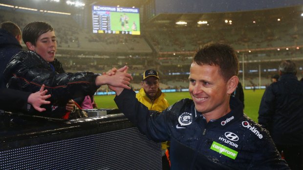 Singing in the rain: Blues head coach Brendon Bolton greets fans after the win.