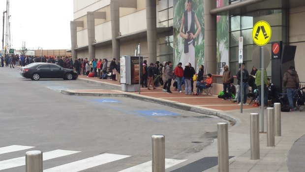 A line of more than 100 people outside Chadstone Shopping Centre in Victoria.